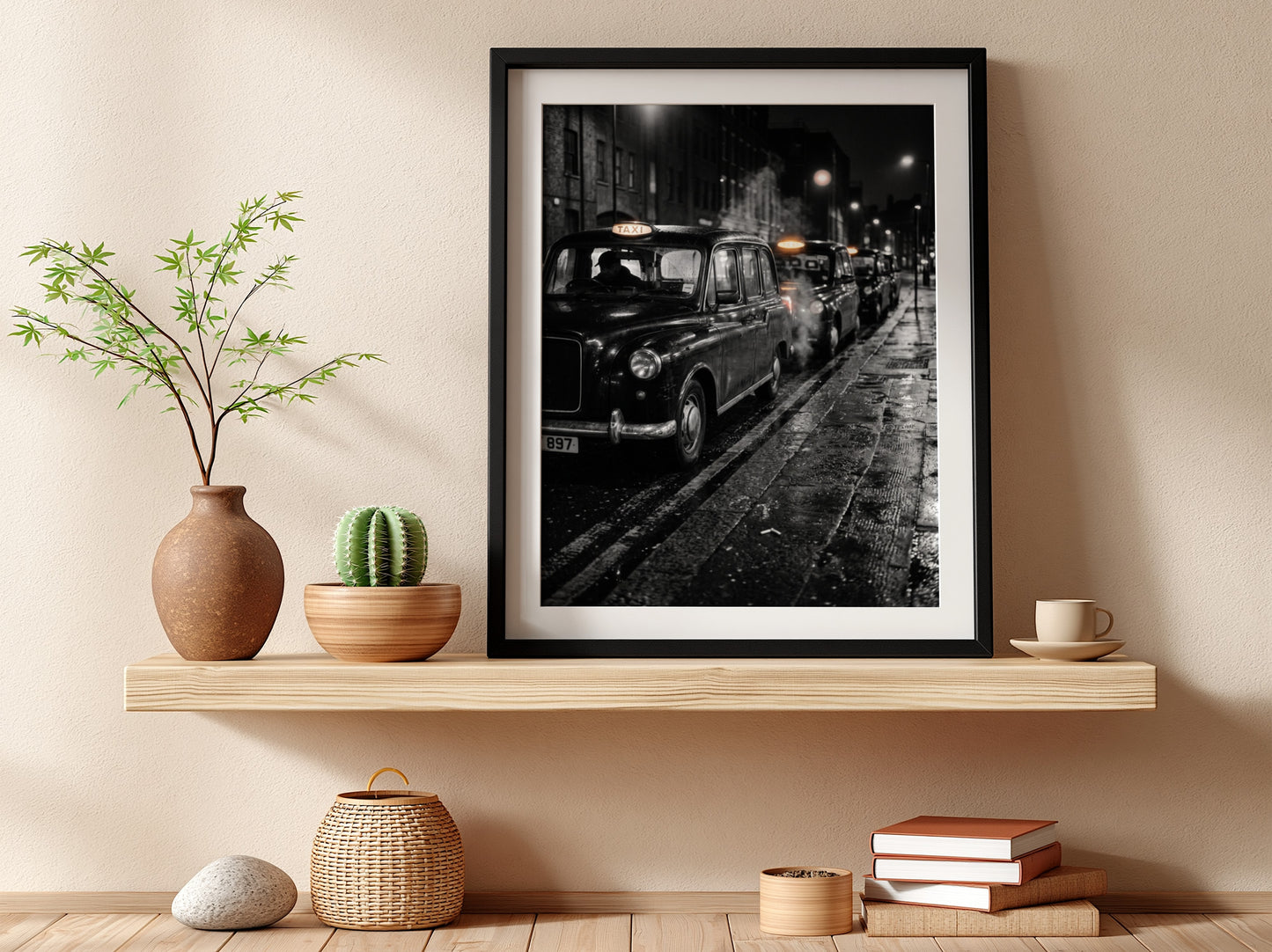 Wall decor showing black and white photo of London black cabs lined up at night on wet street