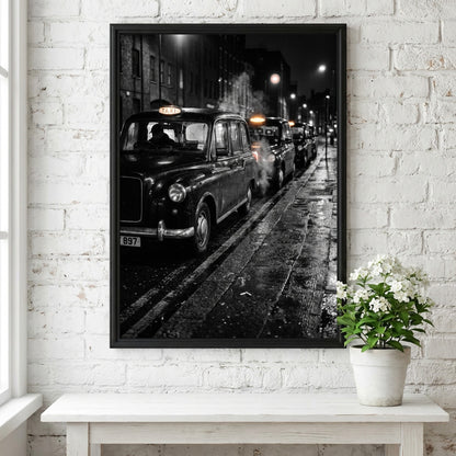 Wall decor showing black and white photo of London black cabs lined up at night on wet street