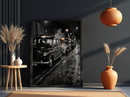 Wall decor showing black and white photo of London black cabs lined up at night on wet street