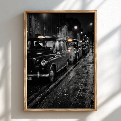 Wall decor showing black and white photo of London black cabs lined up at night on wet street