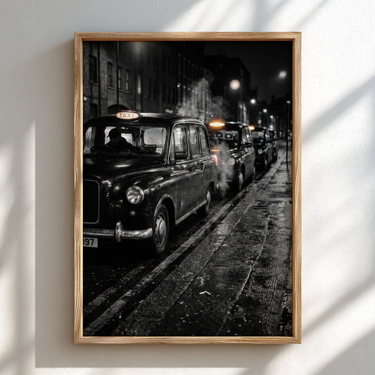 Wall decor showing black and white photo of London black cabs lined up at night on wet street