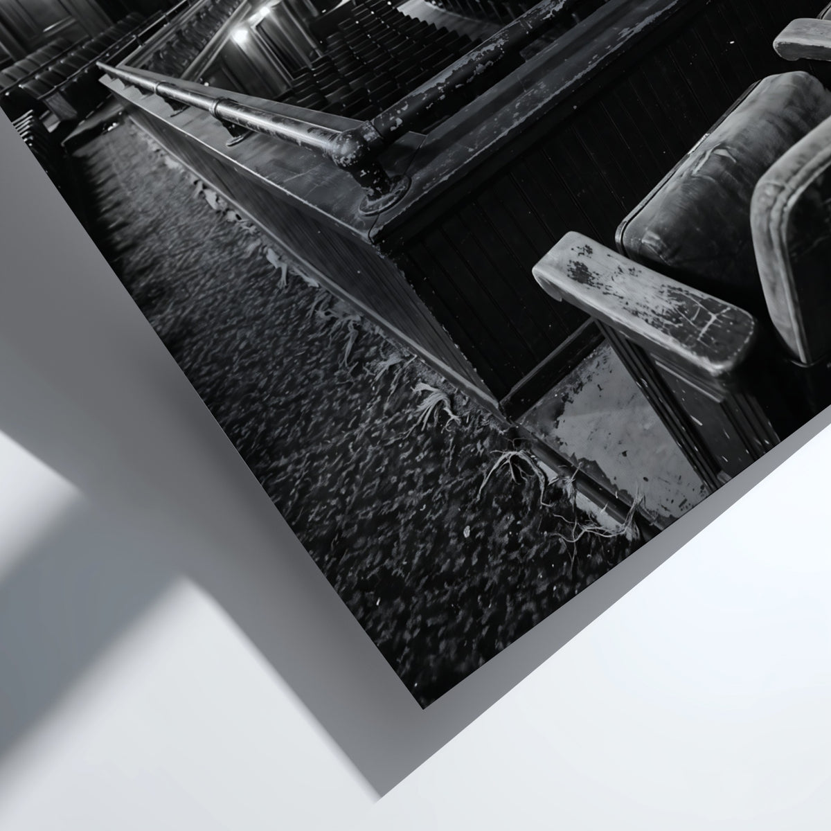 Black and white poster showing vintage theater balcony view with seats and stage