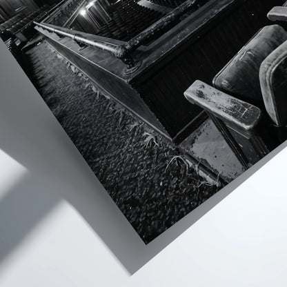 Black and white poster showing vintage theater balcony view with seats and stage