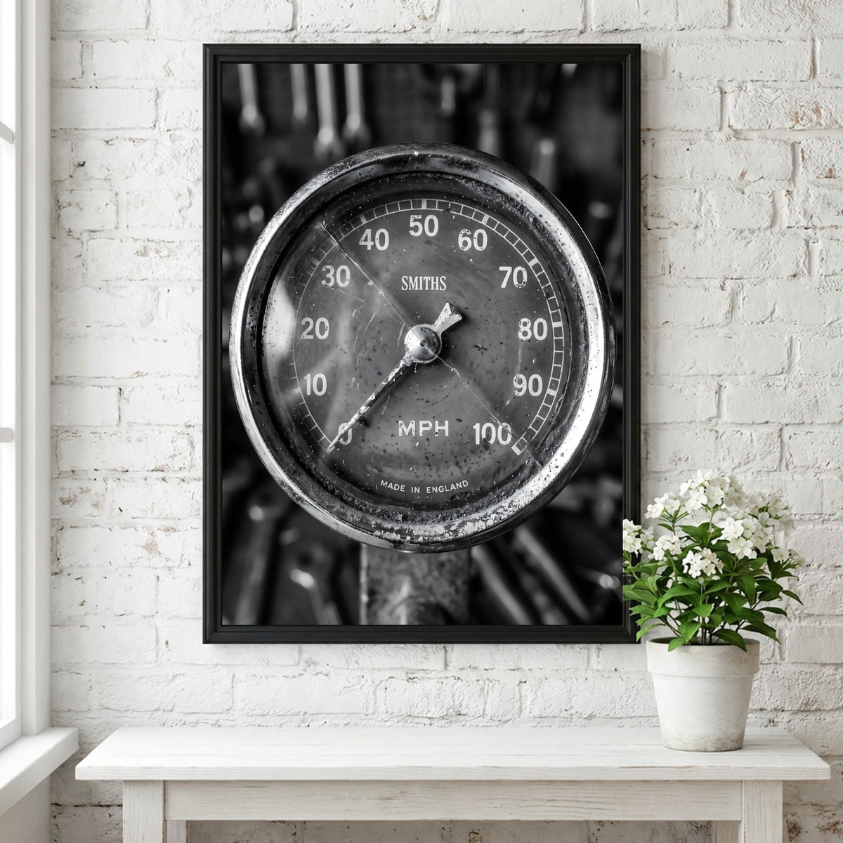 Vintage motorcycle speedometer wall decor in black and white with Smiths branding and retro style