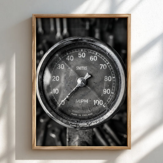 Vintage motorcycle speedometer wall decor in black and white with Smiths branding and retro style