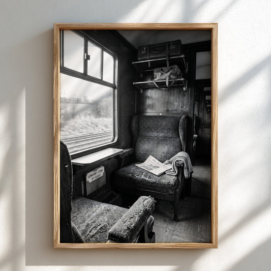vintage train carriage interior wall decor black and white photo with worn seats and luggage rack