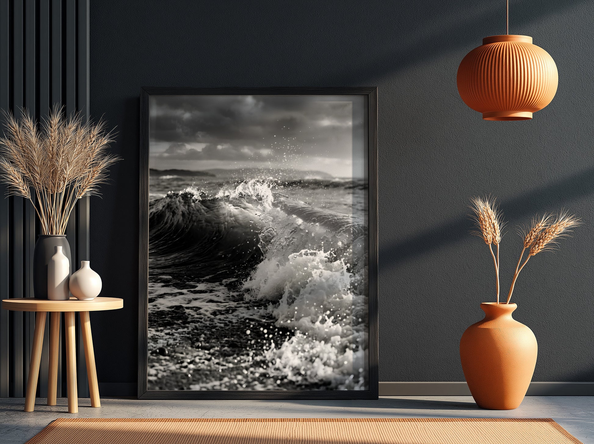 Black and white poster of a breaking wave on rocky beach with splashing water and moody sky