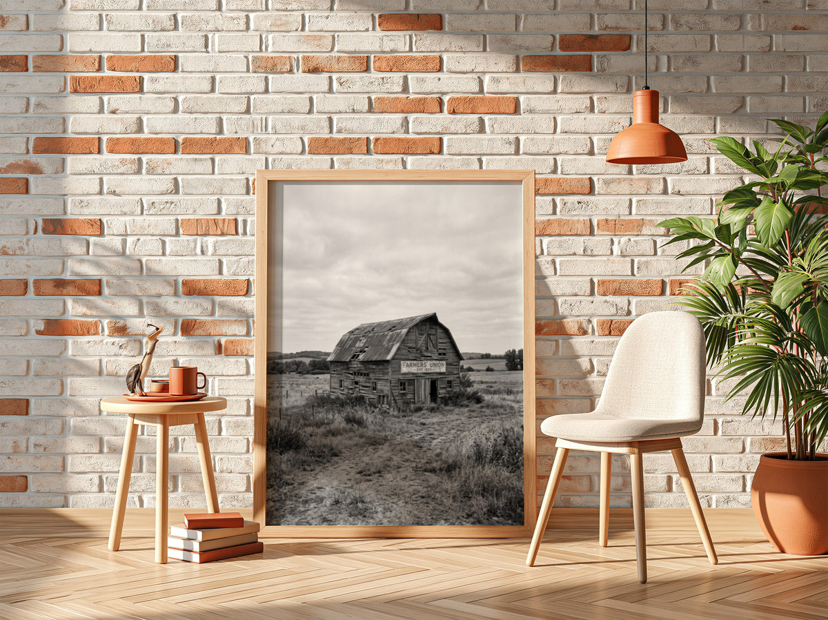 Weathered wooden barn poster in monochrome showing rustic barn in field with tall grass and cloudy sky
