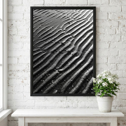 Poster of wet sand at low tide with black and gray rippled patterns and textured surface