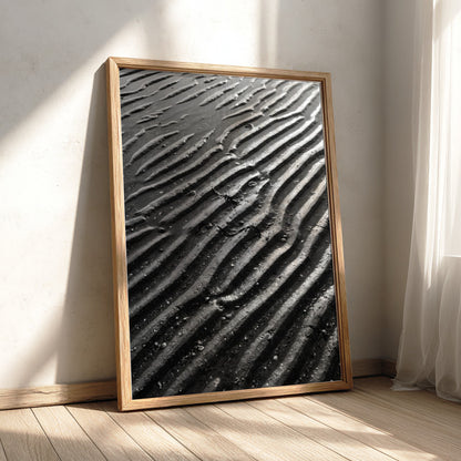 Poster of wet sand at low tide with black and gray rippled patterns and textured surface