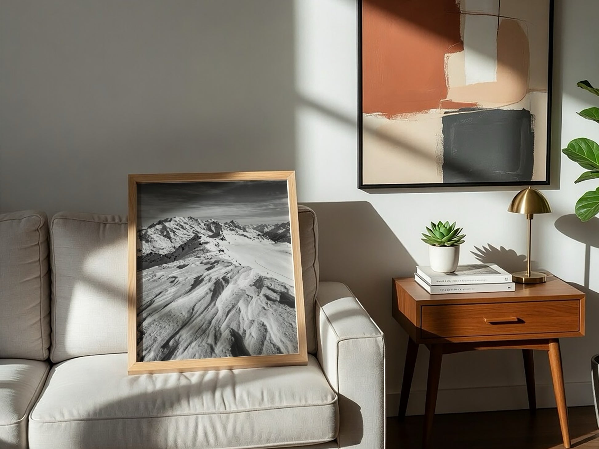 Photographic wall decor of black and white wind sculpted snow ridge with alpine mountains and textured snow