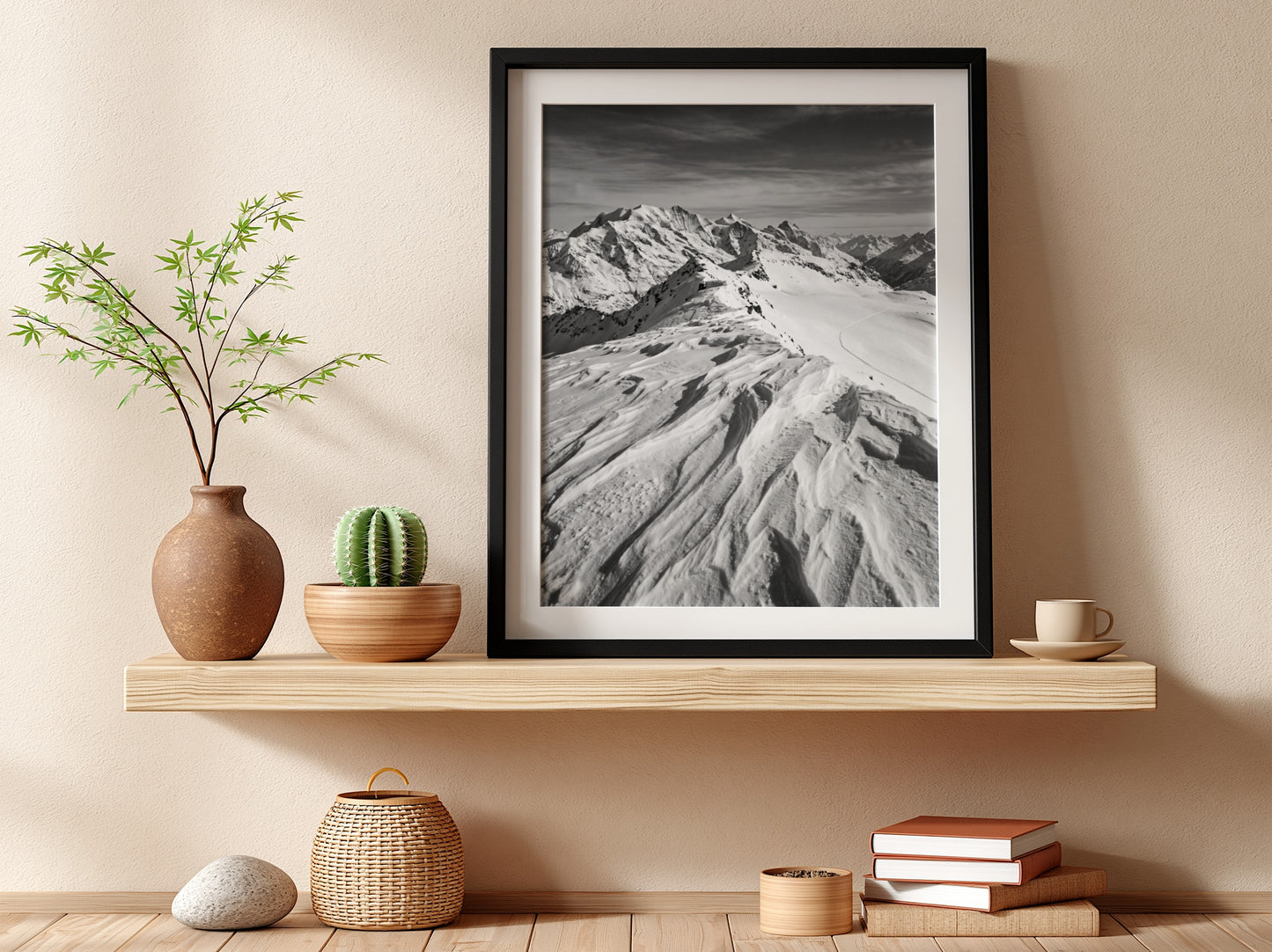 Photographic wall decor of black and white wind sculpted snow ridge with alpine mountains and textured snow