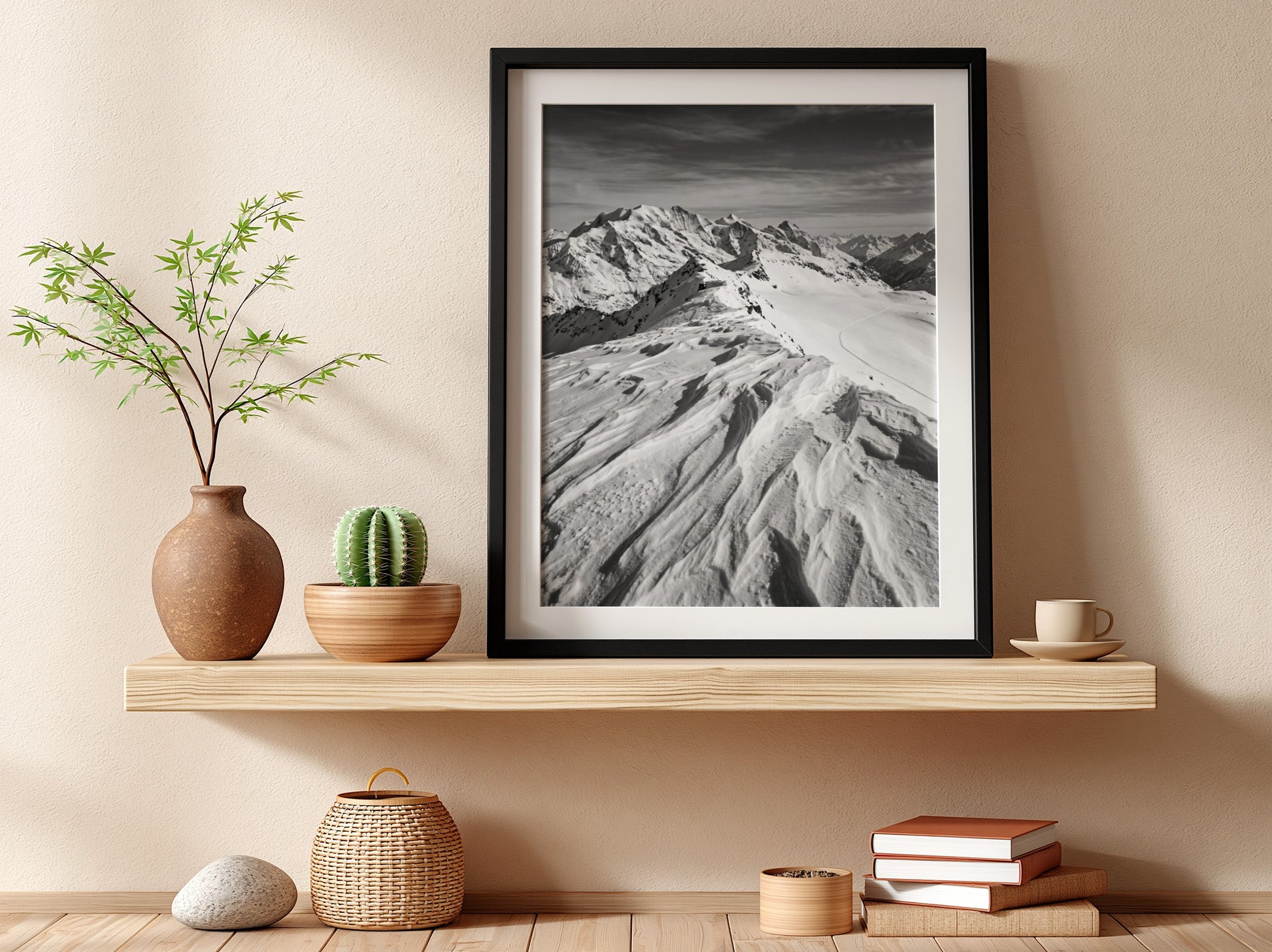 Photographic wall decor of black and white wind sculpted snow ridge with alpine mountains and textured snow
