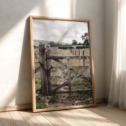 Wooden farm gate wall decor with rustic wood texture, barbed wire, and countryside background