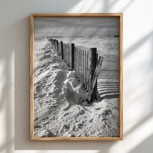 monochrome wall decor featuring wooden snow fence with textured snow and shadows in black and white
